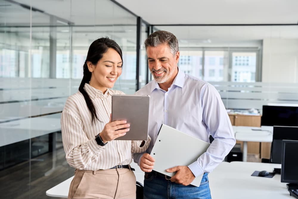 Business Banking Services | A man and woman looking at something on a tablet